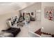 Bright living room featuring high ceilings and large windows providing an abundance of natural light at 8555 W Purdue Ave, Peoria, AZ 85345