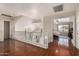 Open loft area boasts hardwood floors and a view into a bedroom with natural light at 8555 W Purdue Ave, Peoria, AZ 85345