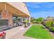 Stylish covered patio featuring comfortable seating and a well-maintained yard, perfect for outdoor entertaining at 93 E Santa Lucia Ln, Queen Creek, AZ 85140
