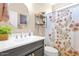 Stylish bathroom featuring a floral shower curtain and modern sink at 93 E Santa Lucia Ln, Queen Creek, AZ 85140