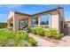 Beautifully landscaped backyard showcasing a covered patio and lush greenery, offering serene outdoor living at 93 E Santa Lucia Ln, Queen Creek, AZ 85140