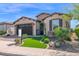Charming one-story home featuring a lush, green front lawn and well-maintained landscaping at 93 E Santa Lucia Ln, Queen Creek, AZ 85140