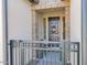 Charming home entrance with a decorative wreath on the front door and a secure iron gate at 93 E Santa Lucia Ln, Queen Creek, AZ 85140