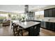 Modern kitchen featuring an expansive island with seating, sleek countertops, and open layout at 93 E Santa Lucia Ln, Queen Creek, AZ 85140