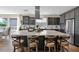 Elegant kitchen featuring a large island, stainless steel appliances, and modern finishes at 93 E Santa Lucia Ln, Queen Creek, AZ 85140
