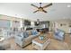 Open living space with kitchen, dining area and large ceiling fan at 93 E Santa Lucia Ln, Queen Creek, AZ 85140