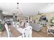 Open concept with kitchen, dining area, living room, and fireplace at 93 E Santa Lucia Ln, Queen Creek, AZ 85140