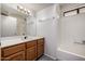 Bathroom showcasing a vanity, mirror and shower-tub combo at 9622 N 112Th Ave, Sun City, AZ 85351