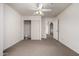 Bedroom showcasing carpet, a ceiling fan, and a convenient sliding door closet at 9622 N 112Th Ave, Sun City, AZ 85351