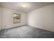 Bedroom with carpet, light fixture, and window with blinds at 9622 N 112Th Ave, Sun City, AZ 85351