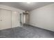 Bedroom with carpet and double-door closet at 9622 N 112Th Ave, Sun City, AZ 85351