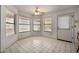 Bright breakfast nook with lots of natural light, tile floors, and backyard access at 9622 N 112Th Ave, Sun City, AZ 85351