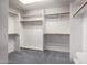 Walk-in closet with carpet and a variety of storage options at 9622 N 112Th Ave, Sun City, AZ 85351