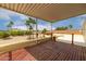 Second story covered deck with views of the yard, palm trees, and neighboring homes at 9622 N 112Th Ave, Sun City, AZ 85351