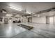 Expansive garage space with car lift access and ample room for projects at 9622 N 112Th Ave, Sun City, AZ 85351