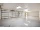 Spacious three car garage with painted floors, skylights, and ample lighting at 9622 N 112Th Ave, Sun City, AZ 85351