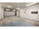 View of garage space with door access, storage, and carpet at 9622 N 112Th Ave, Sun City, AZ 85351