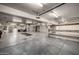 Large garage with plenty of space, shelving, and a well-maintained floor at 9622 N 112Th Ave, Sun City, AZ 85351