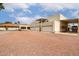 The back of the home offers three-car garage parking and space for extra vehicles at 9622 N 112Th Ave, Sun City, AZ 85351