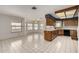 Eat-in kitchen featuring tile floors, a center island, and a breakfast nook at 9622 N 112Th Ave, Sun City, AZ 85351