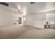 Upstairs living room with a ceiling fan, carpet, and a comfortable chair at 9622 N 112Th Ave, Sun City, AZ 85351