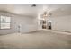 Upstairs living room featuring carpet, a ceiling fan, and a wet bar at 9622 N 112Th Ave, Sun City, AZ 85351