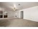 Spacious living room with carpet and a ceiling fan, great for gatherings at 9622 N 112Th Ave, Sun City, AZ 85351