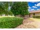 Well-maintained backyard with mature landscaping, screened-in patio, and ample space for outdoor activities at 9805 W Gulf Hills Dr, Sun City, AZ 85351