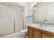 Bright bathroom with a shower, vanity, and sliding glass door at 9805 W Gulf Hills Dr, Sun City, AZ 85351