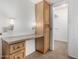 Dressing area with vanity, built-in cabinet and walk-in closet at 9805 W Gulf Hills Dr, Sun City, AZ 85351