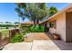 Charming home featuring lush landscaping, a mature tree, and a welcoming entrance at 9805 W Gulf Hills Dr, Sun City, AZ 85351