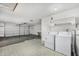 Functional garage space with laundry area and ample room for storage at 9805 W Gulf Hills Dr, Sun City, AZ 85351