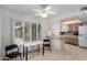 Bright eat-in kitchen with an eat-at peninsula and window shutters at 9805 W Gulf Hills Dr, Sun City, AZ 85351