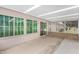 Enclosed patio with outdoor access and partial view of the lawn at 9805 W Gulf Hills Dr, Sun City, AZ 85351