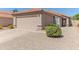 Charming single-story home featuring a two-car garage, desert landscaping, and a classic tile roof at 17434 N 46Th Pl, Phoenix, AZ 85032