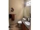 Bathroom features a granite countertop, stylish fixtures, and unique southwestern-themed wall art at 1001 N Pasadena St # 162, Mesa, AZ 85201