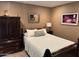 Comfortable bedroom showcases wood furniture, plush bedding, and soothing decor at 1001 N Pasadena St # 162, Mesa, AZ 85201