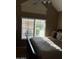 Bedroom with vaulted ceiling and bright window at 1001 N Pasadena St # 162, Mesa, AZ 85201