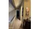 Upper hallway with carpet, artwork and view of bedroom and closet at 1001 N Pasadena St # 162, Mesa, AZ 85201
