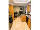 Bright kitchen adjacent to a dining area and fireplace at 1001 N Pasadena St # 162, Mesa, AZ 85201