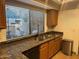 Kitchen featuring stainless sink and granite countertop at 1001 N Pasadena St # 162, Mesa, AZ 85201