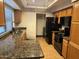 Kitchen with granite counters, stainless steel appliances, and ample cabinet space at 1001 N Pasadena St # 162, Mesa, AZ 85201