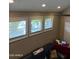 Inviting living room featuring three bright windows and comfortable seating area at 1001 N Pasadena St # 162, Mesa, AZ 85201