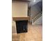 Stylish living room featuring a fireplace and staircase leading to the second floor at 1001 N Pasadena St # 162, Mesa, AZ 85201