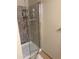 Modern shower featuring sleek glass door and tiled walls at 1001 N Pasadena St # 162, Mesa, AZ 85201