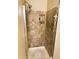 Walk-in shower features neutral-toned tile and updated shower head at 1001 N Pasadena St # 162, Mesa, AZ 85201