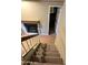 Carpeted staircase with tile flooring leading to the upper level with natural light at 1001 N Pasadena St # 162, Mesa, AZ 85201