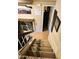 Carpeted stairway features wood and white railing, leading to the home's lower level at 1001 N Pasadena St # 162, Mesa, AZ 85201