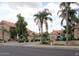 Inviting street view of multi-story homes with mature trees and xeriscaping at 1001 N Pasadena St # 162, Mesa, AZ 85201