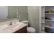 Bathroom featuring mint colored walls and built in shelving at 10228 E Carol Ave, Mesa, AZ 85208